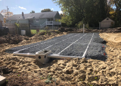 Piping system coverd with gravel in backyard