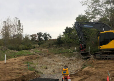 Excavator truck clearing out plot of land