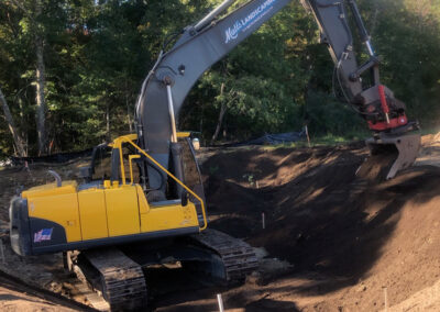 Large excavator truck digging a hole